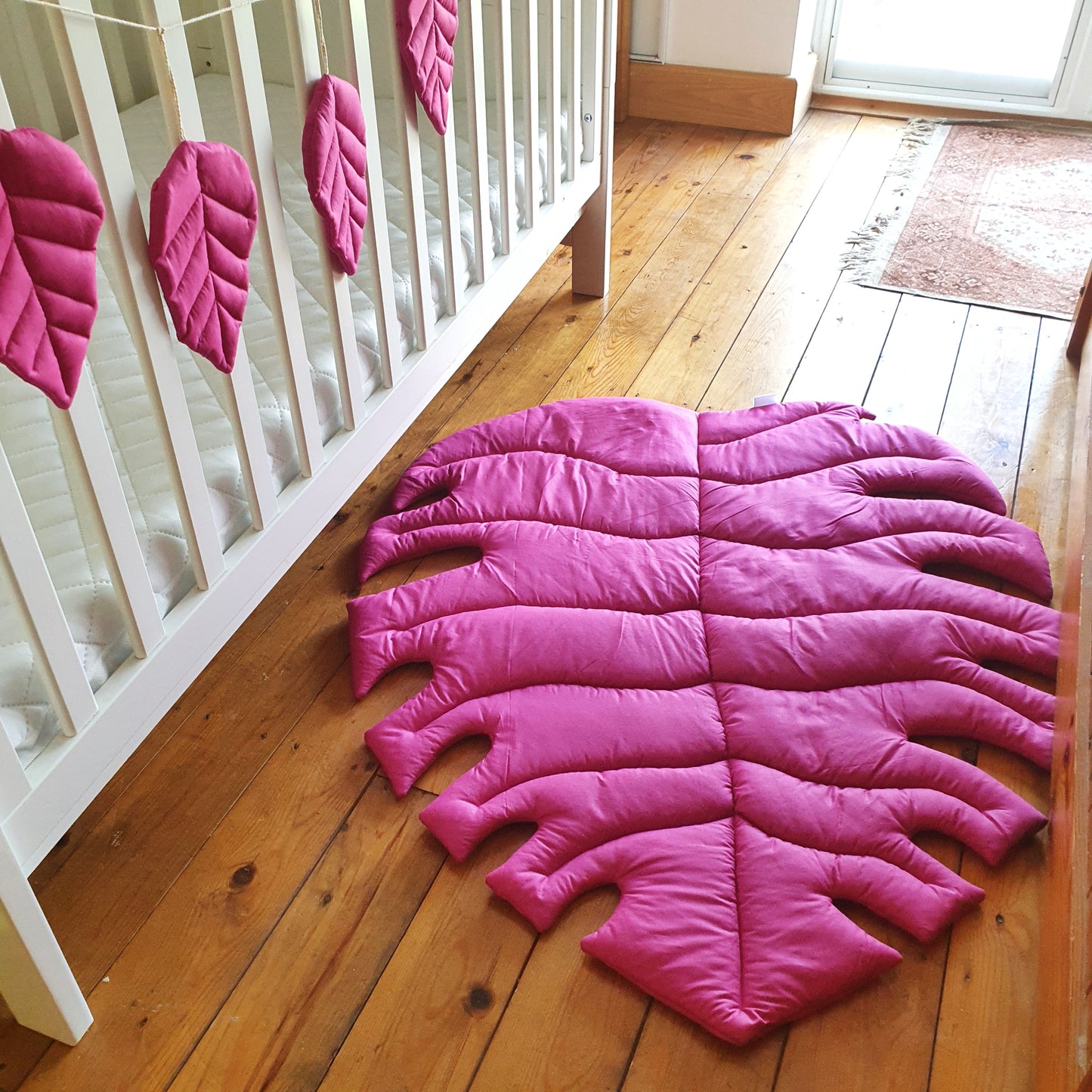 Bright pink Monstera rug Size S